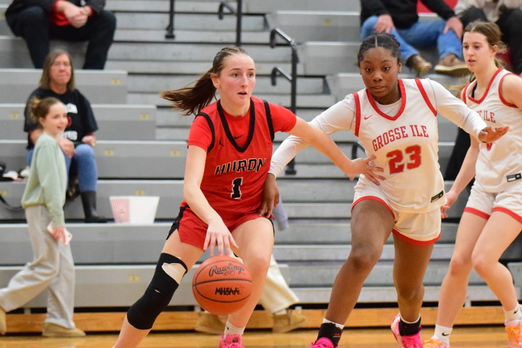 Photo gallery of New Boston Huron vs Grosse Ile in a Huron League girls hoops battle