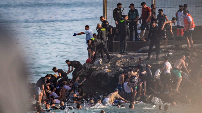 Spain deploys military to Ceuta after thousands of people breach Morocco’s border and at least 9 die