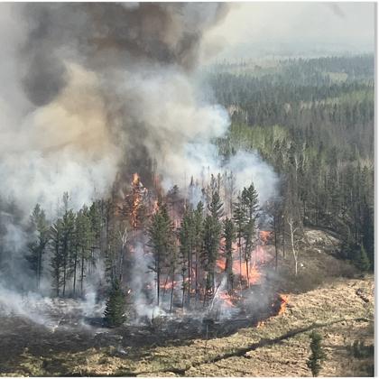 Police say 2 people were killed in massive wildfire in central Canadian province of Manitoba