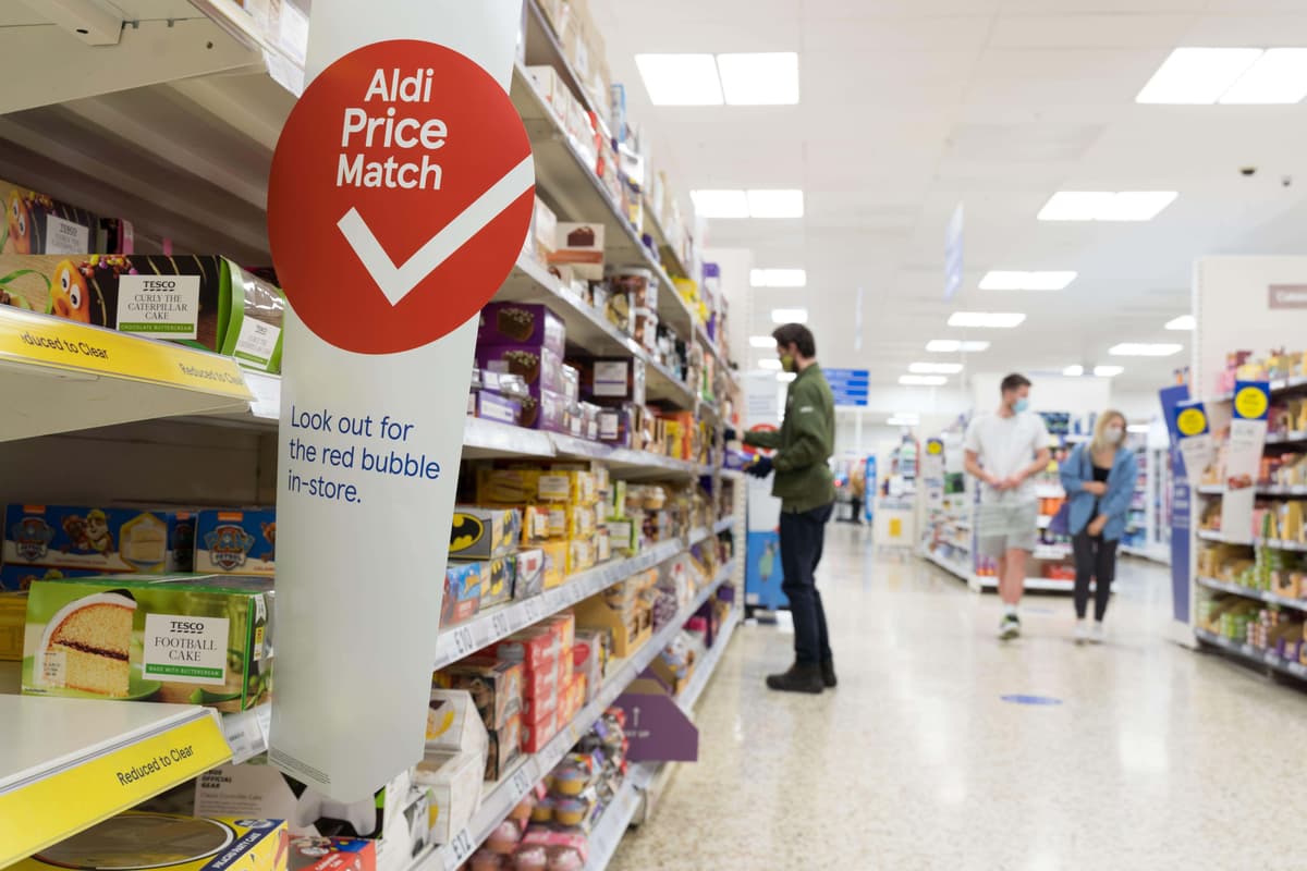 Tesco sees off threat from Asda as it boosts market share and lifts profit guidance