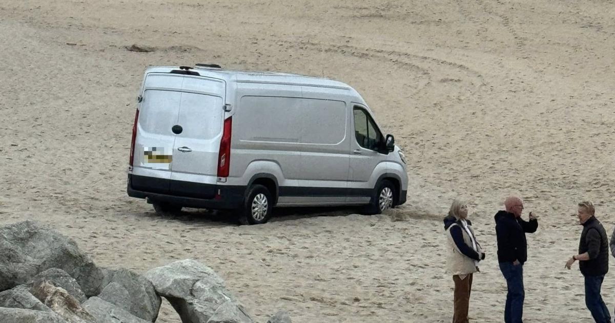 Van driver takes mates' beach invite a bit too literally — and ends up stuck!