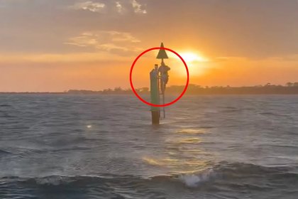 Utter disbelief as fishermen find 'pale' man clinging to pole kilometres from shore: 'Struggling to hold on'