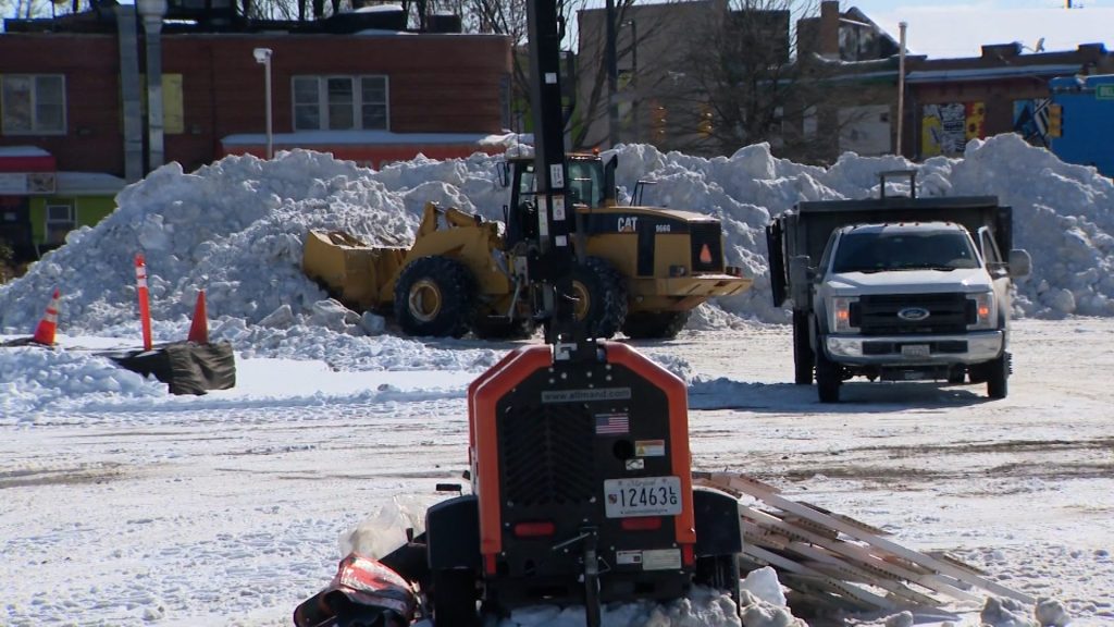 Baltimore City crews remove snow piles in neighborhoods to dump at Pimlico