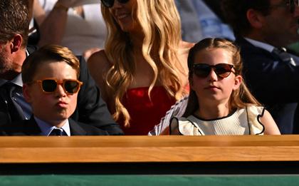 Prince George told Wimbledon doubles champions Julian Cash and Lloyd Glasspool that he is “all right” at tennis