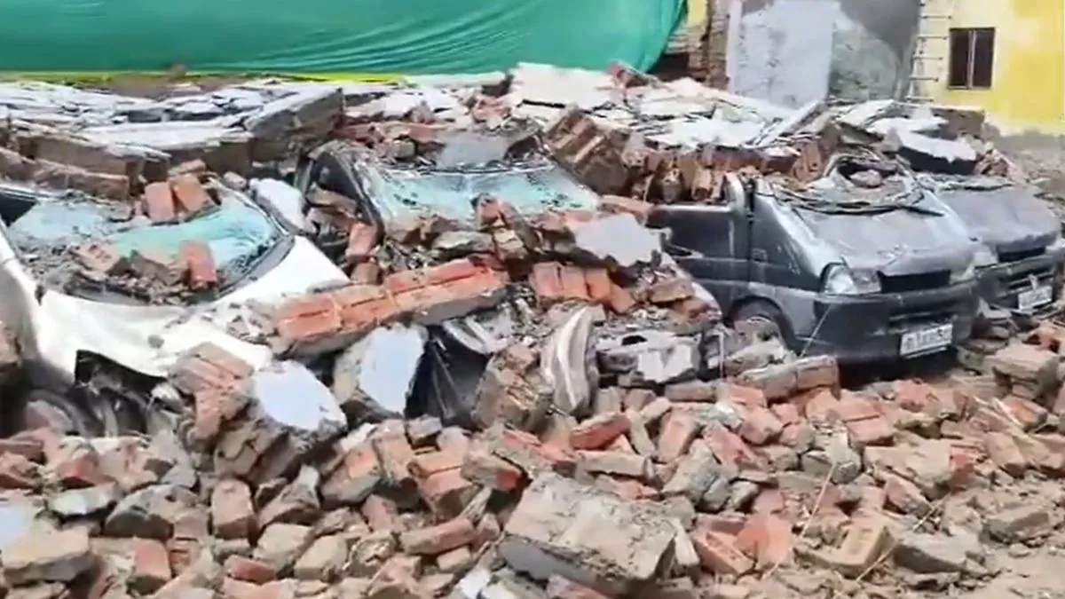 Delhi rain turns chaotic as 8 cars damaged after parking lot wall falls amid heavy downpour in Deoli
