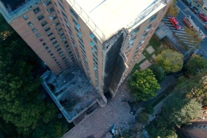 Investigation under way after 17-story New York apartment block partially collapses in suspected gas blast