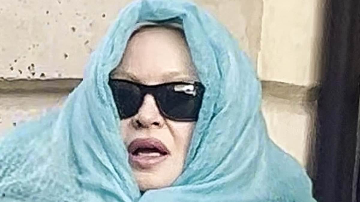Madonna, 67, looks worlds away from her typical glamour as the dishevelled star wraps herself in a scarf while leaving her hotel in Paris