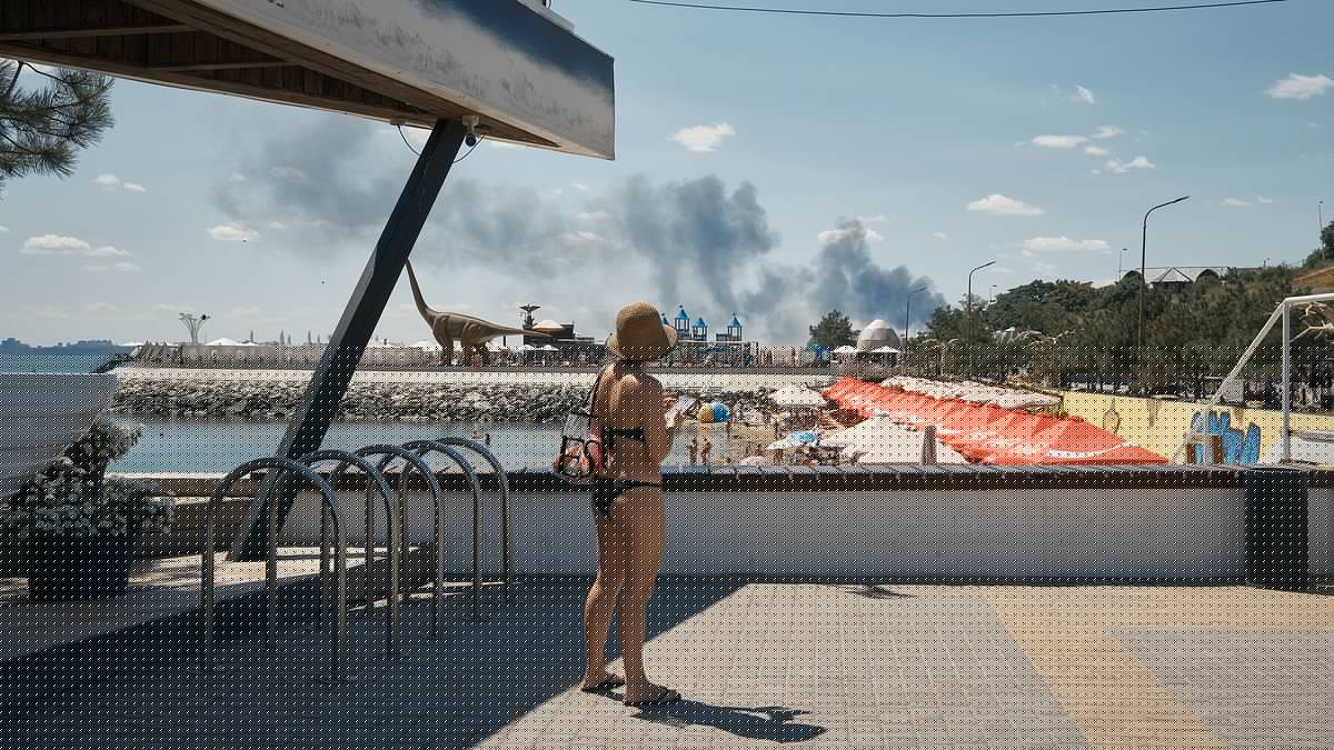 Ukrainian tourists sunbathe as Putin's bombs rain down near Black Sea beach resort