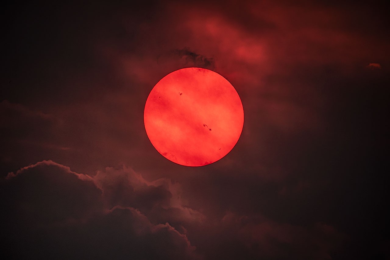 APOD: July 30 – Red Sun trough Wildfire Smoke