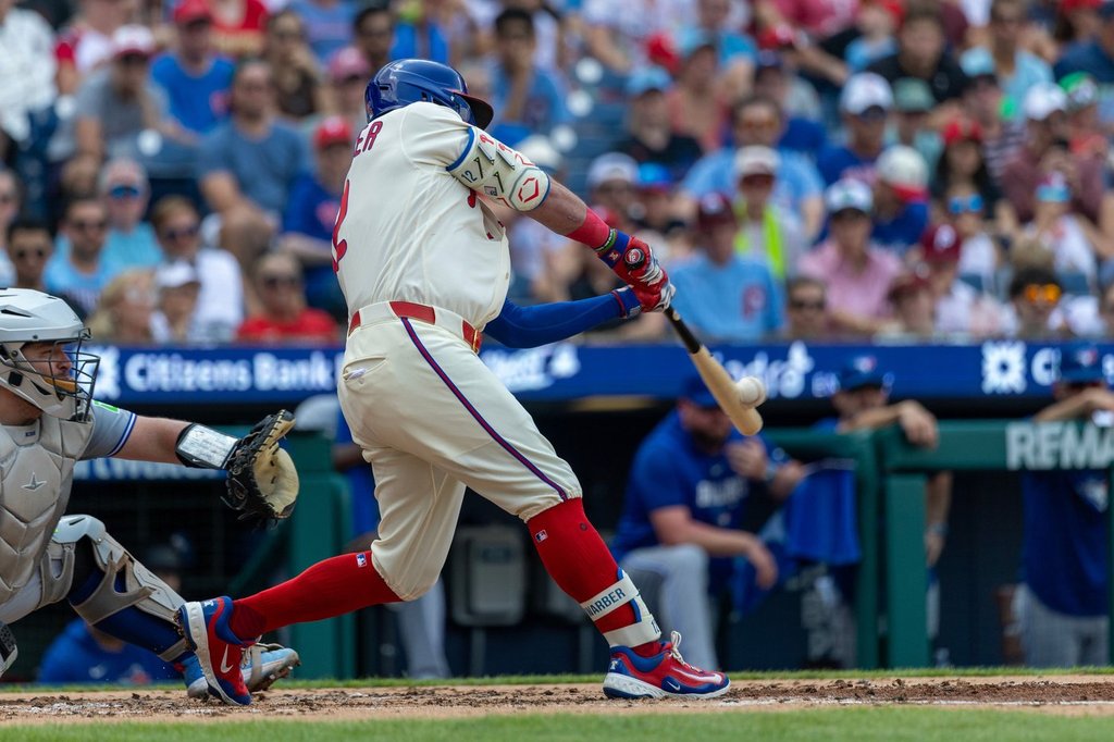 Schwarber hits 2 HRs, Hill delivers RBI single in 12th inning as Phillies beat Blue Jays 7-6