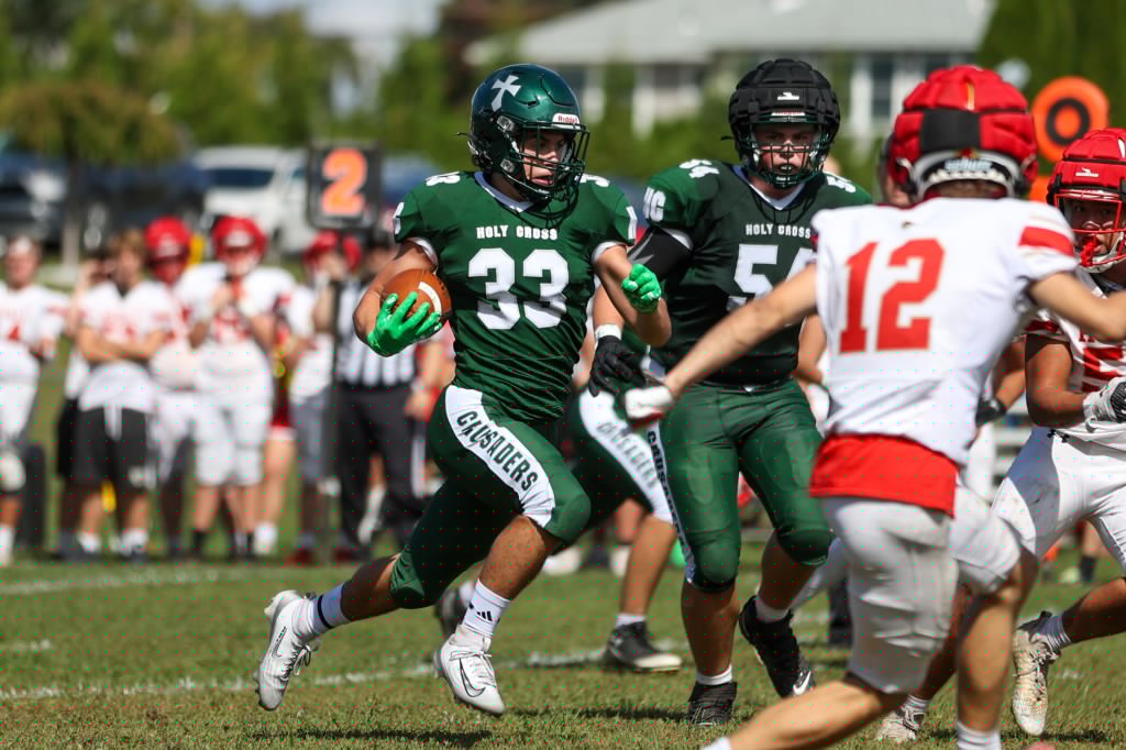 HS FOOTBALL: Holy Cross outlasts Holy Redeemer in wild game