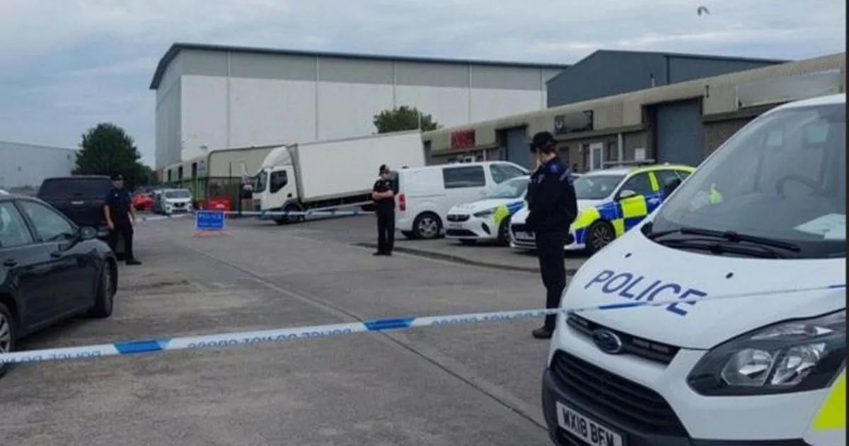 Gunman on the run after drive-by shooting on industrial estate