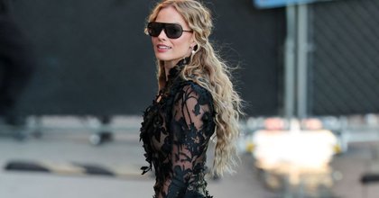 Margot Robbie Turns Heads in Feather Minidress During Press Tour