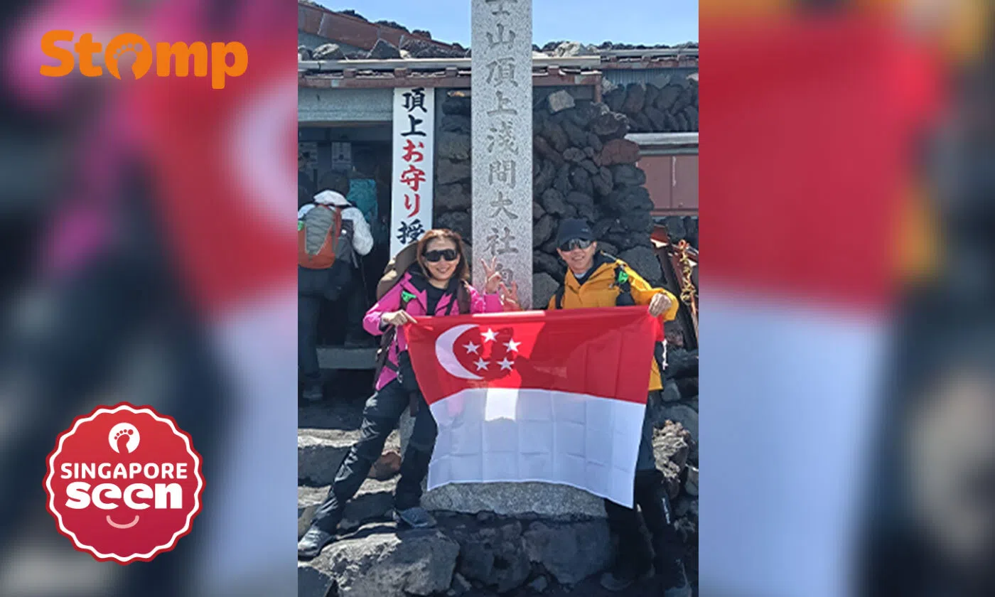 S’pore couple in their 50s conquer first mountain, proudly fly flag atop Mount Fuji for National Day