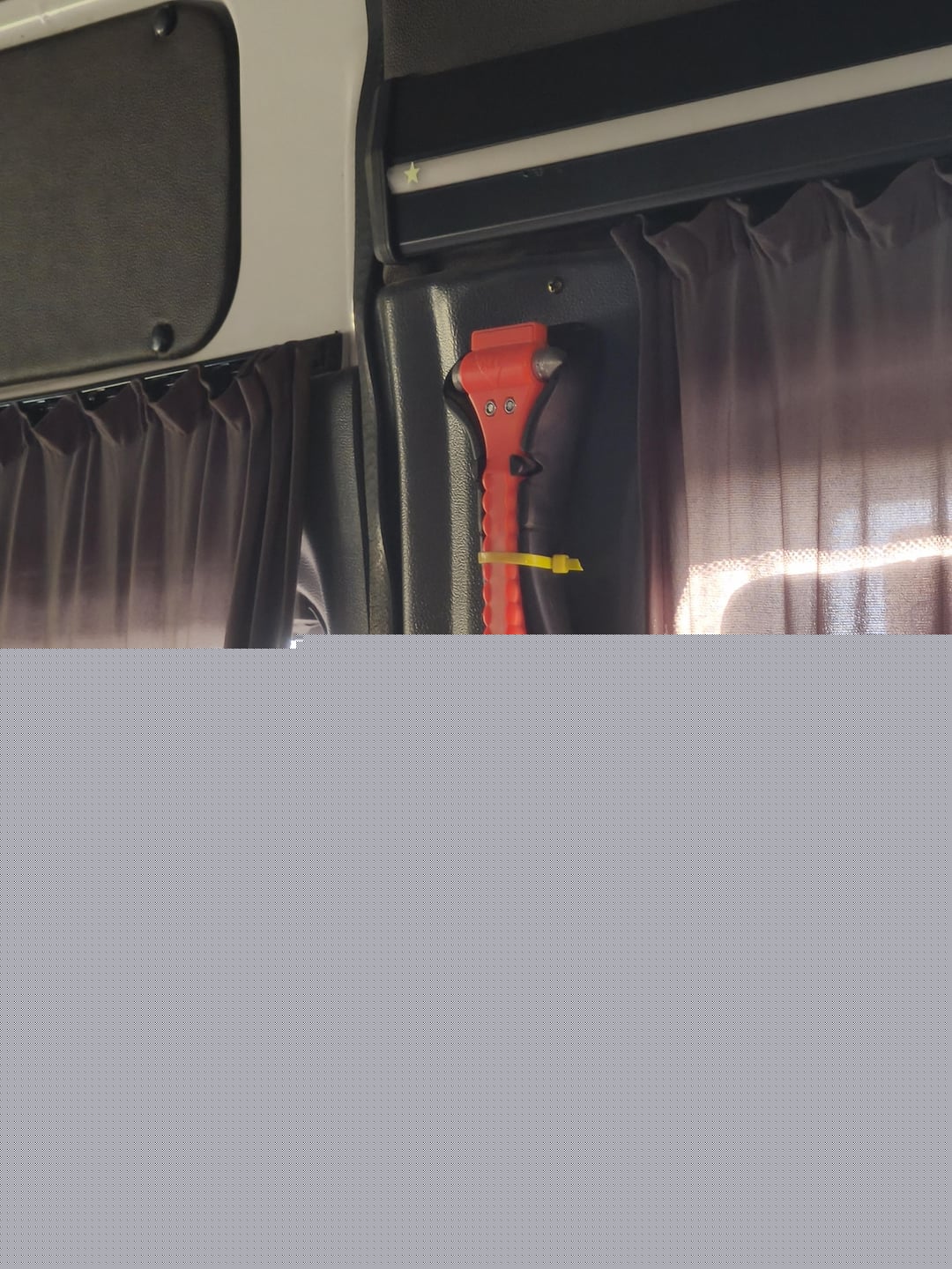 Mildly Infuriating - Emergency glass breaker is zip tied down