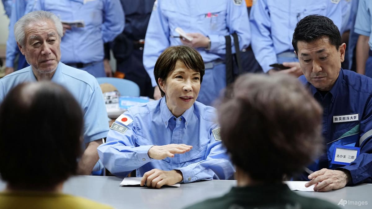 Japanese PM Takaichi visits quake-hit southern region as cleanup begins in intense heat