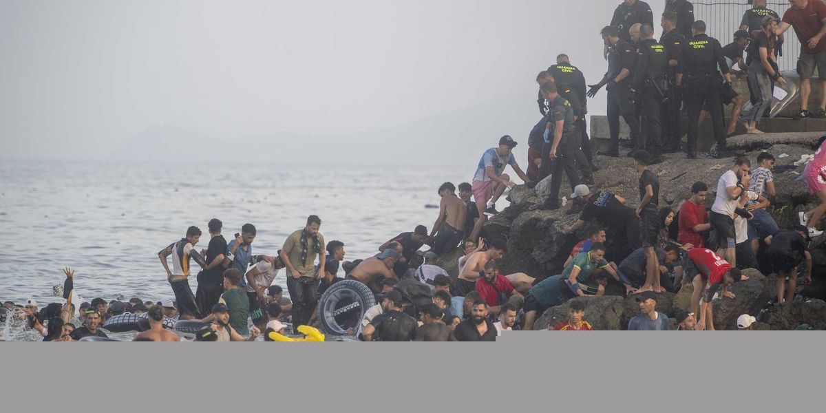 'Absolute chaos': THOUSANDS of migrants OVERRUN border into Spain from Morocco — at least 9 people dead