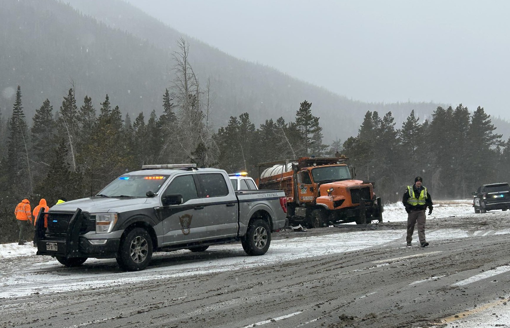 Van carrying youth hockey team collides with snowplow on I-70, killing 1, injuring 8
