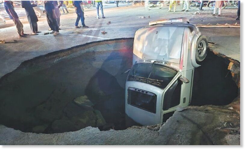 Three injured as car, bike fall into huge sinkhole in Lahore, Pakistan