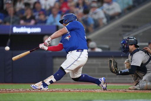 Kirk homers twice as Blue Jays end playoff skid by thumping Yankees 10-1 in Game 1 of ALDS