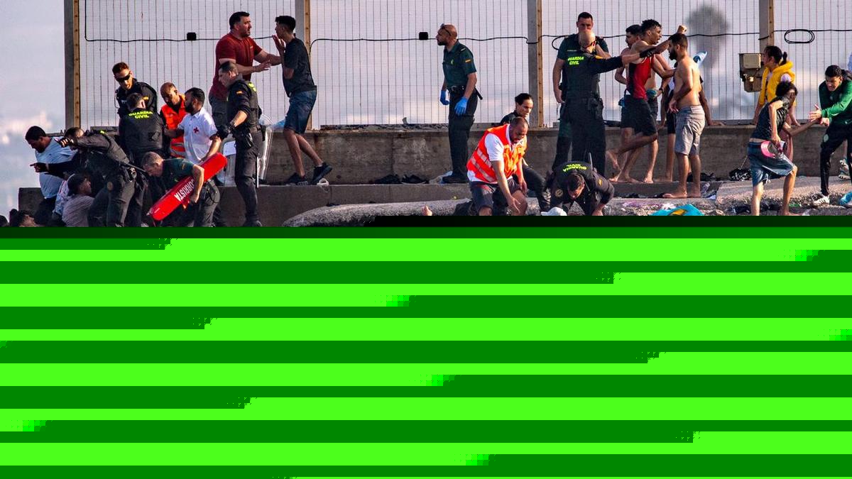 Migrants at Spanish territory's border overwhelm police