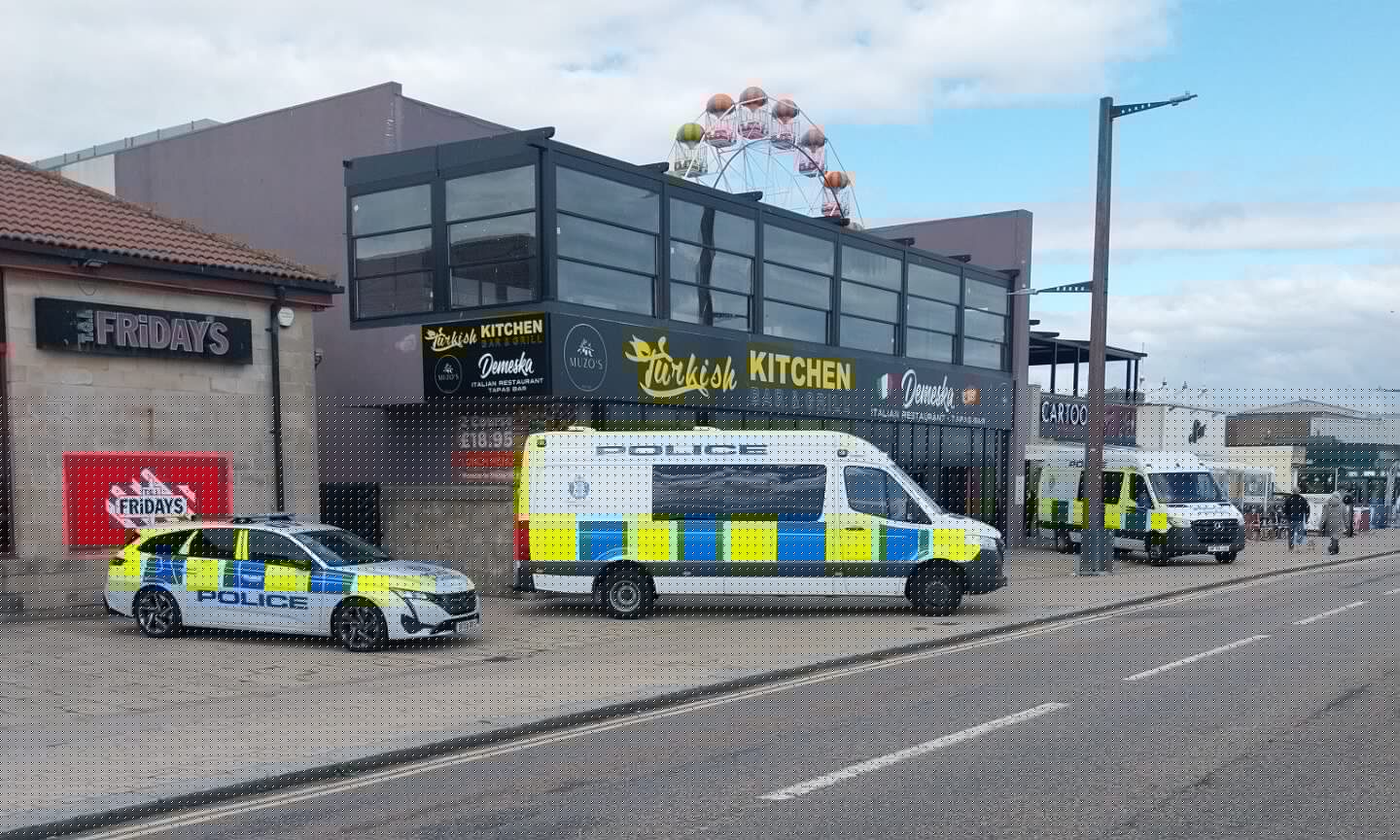 Armed officers attend Muzo’s Turkish Kitchen at Aberdeen beach