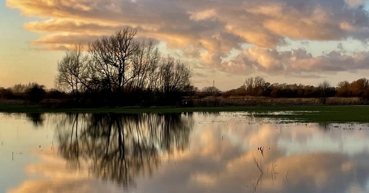 Clouds reflected in the river is a winning club photo