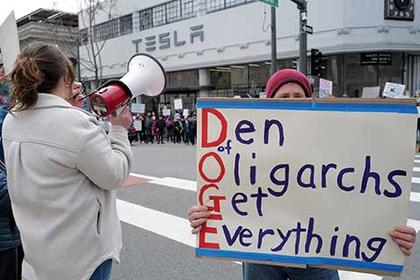 Demonstrators Protest Elon Musk Outside of Tesla Showrooms