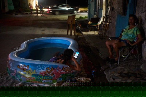 As blackouts stretch for days, life in Cuba revolves around small bursts of electricity